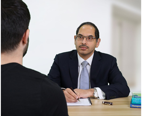 Dr Vimal Sivasanker consulting a patient